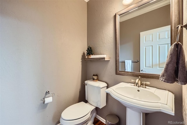 bathroom featuring sink and toilet