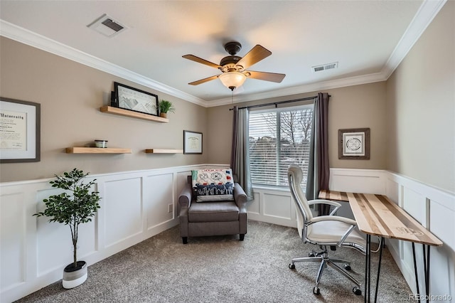 office space featuring crown molding, ceiling fan, and carpet