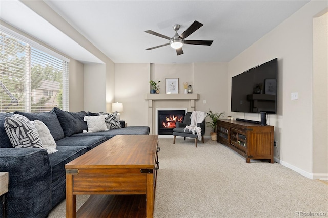 2763 Dharma Ave, Broomfield, CO 80020 - living room featuring a ceiling fan, a glass covered fireplace, and carpet floors