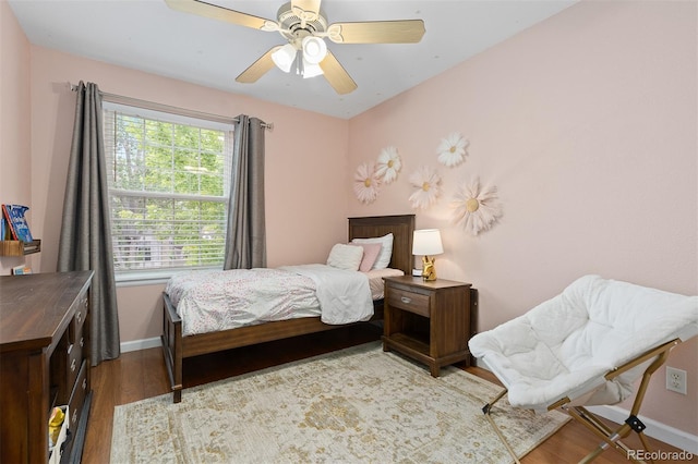2763 Dharma Ave, Broomfield, CO 80020 - bedroom with multiple windows, wood finished floors, and ceiling fan