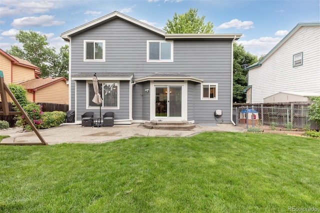 2763 Dharma Ave, Broomfield, CO 80020 - back of house with a patio and a fenced backyard