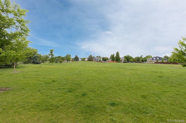 2763 Dharma Ave, Broomfield, CO 80020 - surrounding community with a yard