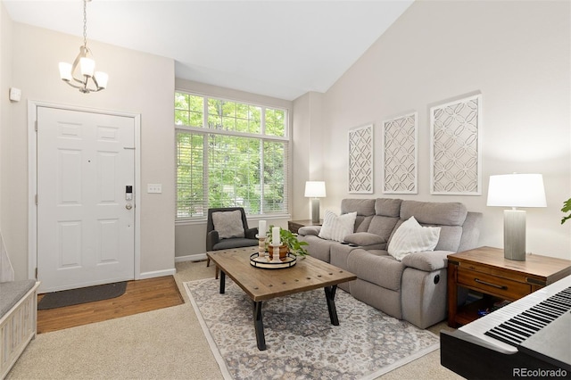 2763 Dharma Ave, Broomfield, CO 80020 - carpeted living room with vaulted ceiling and a chandelier