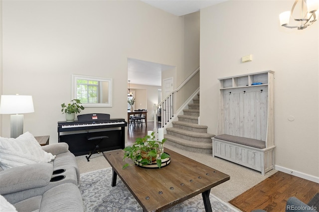 2763 Dharma Ave, Broomfield, CO 80020 - living area with stairway, a chandelier, and a towering ceiling