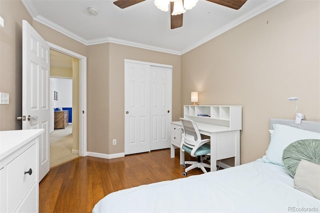 2763 Dharma Ave, Broomfield, CO 80020 - bedroom with wood finished floors, ornamental molding, a closet, and a ceiling fan
