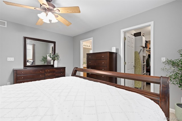 2763 Dharma Ave, Broomfield, CO 80020 - bedroom with a spacious closet, ensuite bathroom, ceiling fan, and a closet