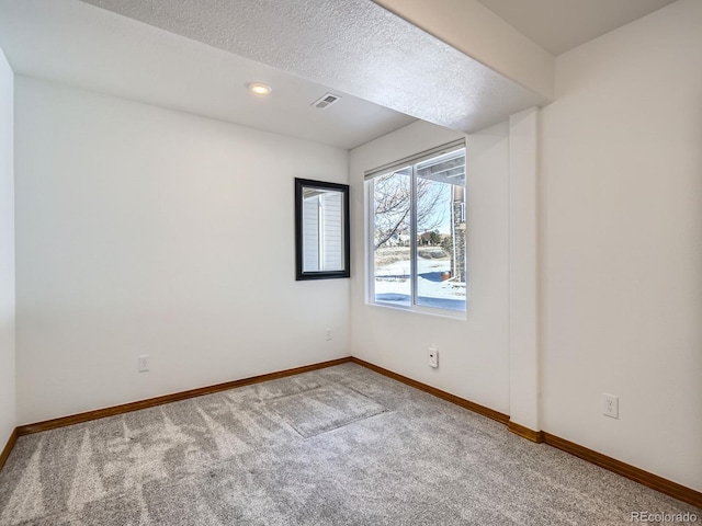 unfurnished room featuring carpet flooring