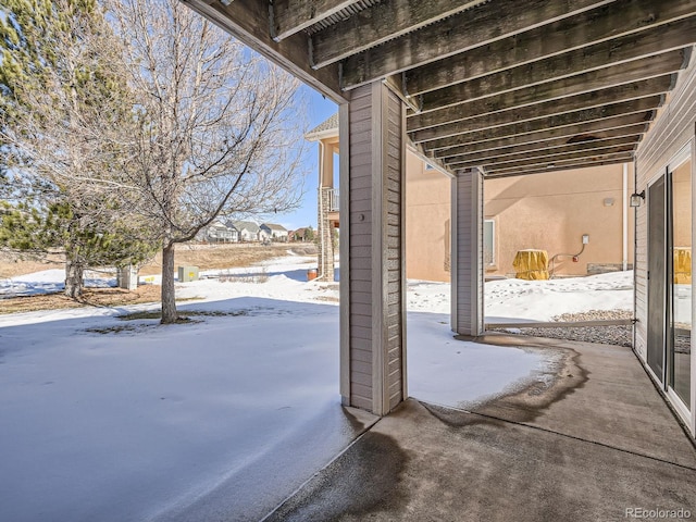 view of snow covered patio