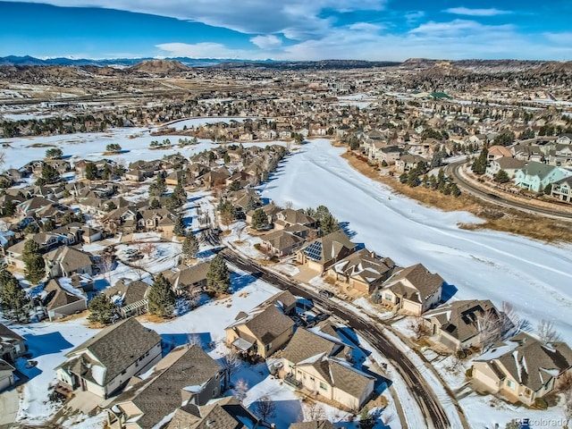 snowy aerial view with a mountain view