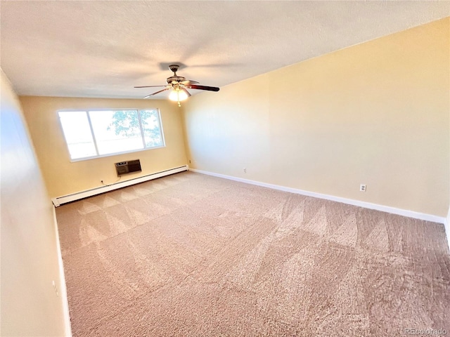 unfurnished room with a baseboard heating unit, ceiling fan, a textured ceiling, and carpet flooring