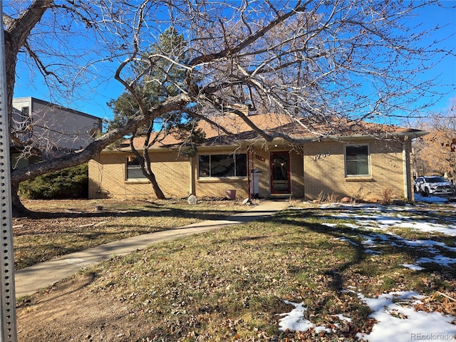 ranch-style house with a lawn