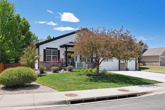 1488 Baguette Dr, Castle Rock, CO 80108 - view of front facade with a front yard, driveway, and brick siding