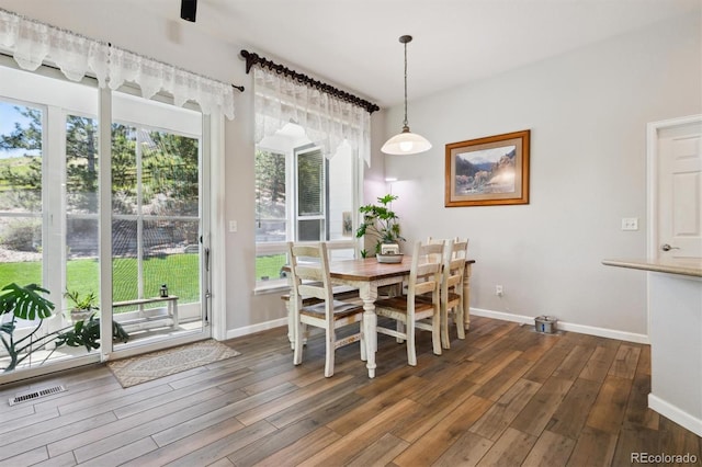 1488 Baguette Dr, Castle Rock, CO 80108 - dining space with dark wood finished floors, baseboards, and plenty of natural light