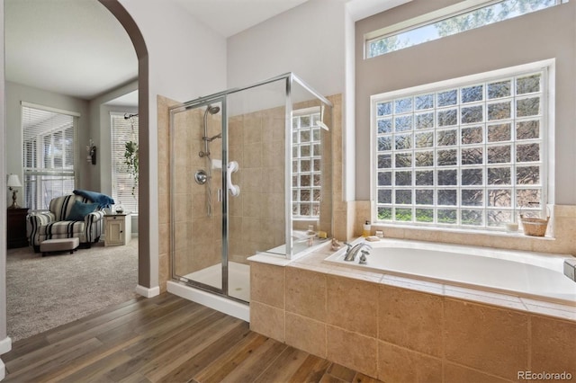 1488 Baguette Dr, Castle Rock, CO 80108 - bathroom with a stall shower, wood finished floors, and healthy amount of natural light