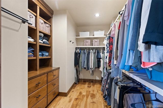 spacious closet featuring light hardwood / wood-style floors