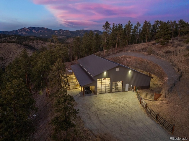 view of front of house with a mountain view and an outbuilding