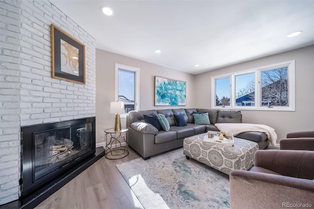 living room featuring hardwood / wood-style floors and a fireplace