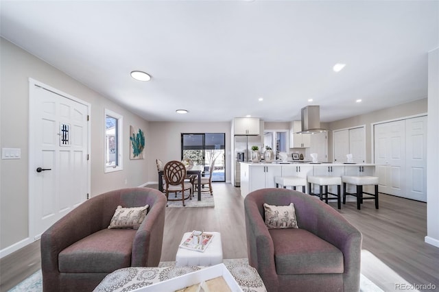 living room with light hardwood / wood-style flooring