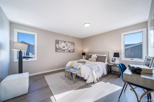 bedroom with hardwood / wood-style flooring