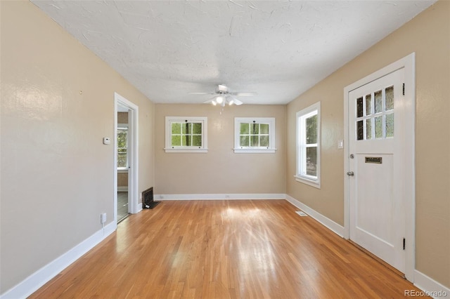 924 E Saint Vrain St, Colorado Springs, CO 80903 - empty room with ceiling fan, baseboards, light wood-style floors, and a textured ceiling