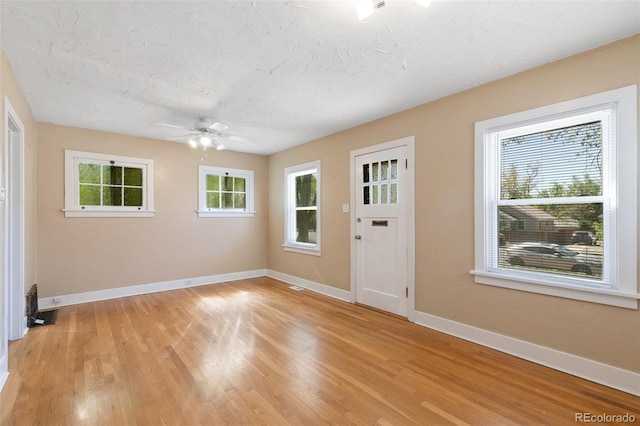 924 E Saint Vrain St, Colorado Springs, CO 80903 - entryway with baseboards, a ceiling fan, and light wood-style floors