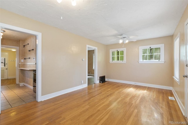 924 E Saint Vrain St, Colorado Springs, CO 80903 - unfurnished room featuring a ceiling fan, light wood-style floors, and baseboards