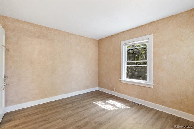 924 E Saint Vrain St, Colorado Springs, CO 80903 - spare room featuring wood finished floors and baseboards