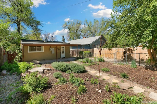 924 E Saint Vrain St, Colorado Springs, CO 80903 - back of property with a fenced backyard and stucco siding