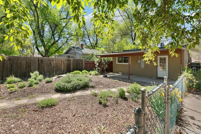 924 E Saint Vrain St, Colorado Springs, CO 80903 - view of front of property with a fenced backyard, a patio, and stucco siding