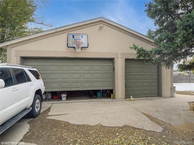 garage featuring fence
