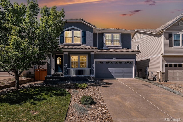 1963 Hogan Ct, Castle Rock, CO 80109 - traditional-style house featuring a tiled roof, concrete driveway, a garage, stucco siding, and a lawn