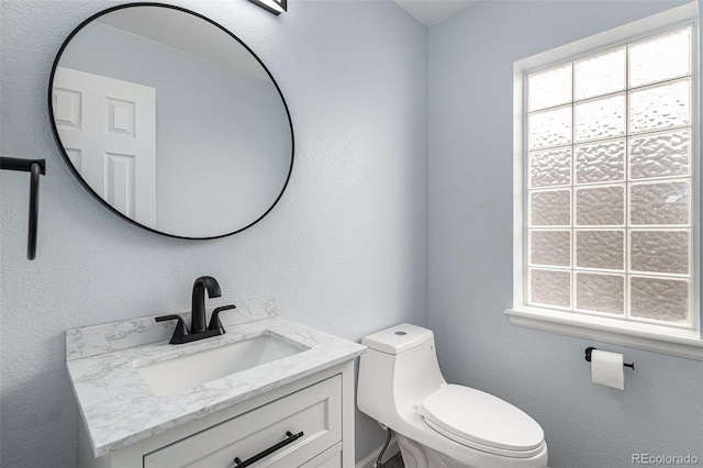 1963 Hogan Ct, Castle Rock, CO 80109 - bathroom featuring plenty of natural light, vanity, and toilet