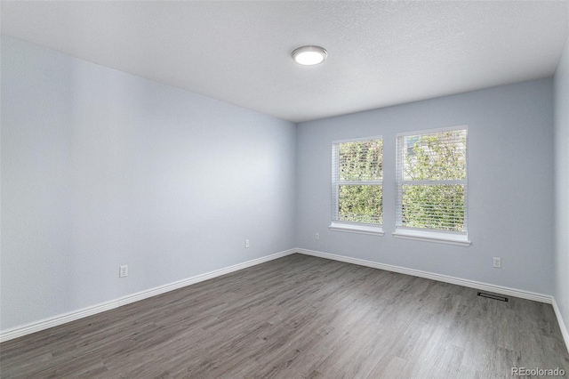 1963 Hogan Ct, Castle Rock, CO 80109 - unfurnished room featuring dark wood-style flooring and baseboards