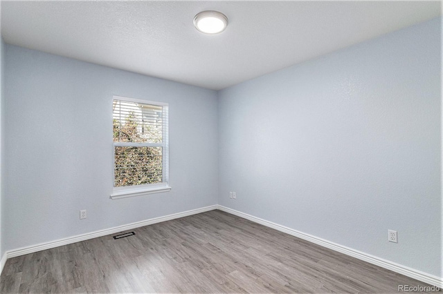 1963 Hogan Ct, Castle Rock, CO 80109 - spare room with wood finished floors and baseboards