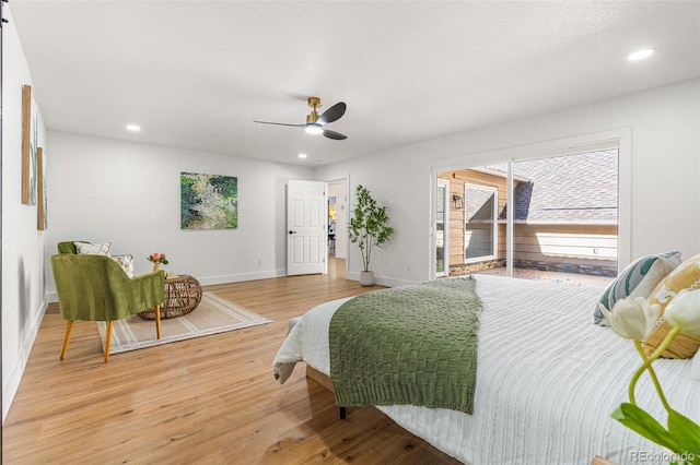 bedroom featuring access to outside, hardwood / wood-style floors, and ceiling fan