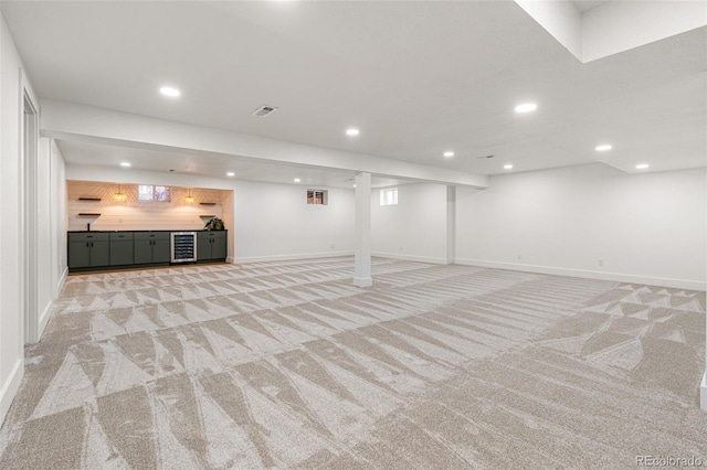 basement with light carpet and wine cooler