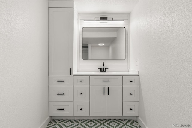 bathroom featuring vanity and a textured ceiling