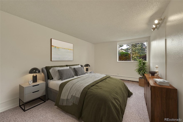 bedroom with a baseboard radiator, light carpet, and a textured ceiling