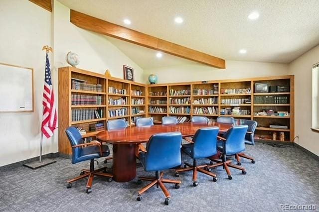 office space featuring lofted ceiling with beams, carpet, and a textured ceiling