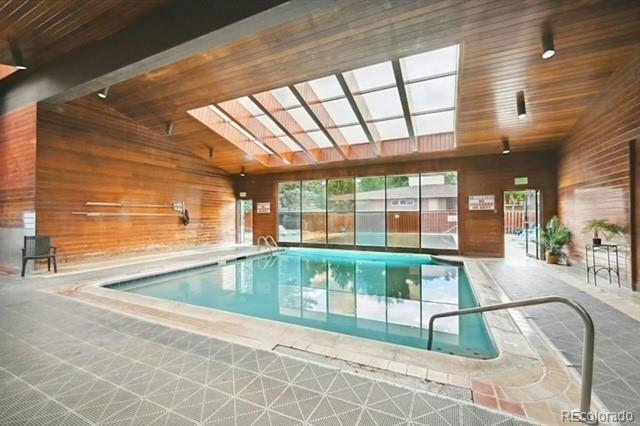 view of pool featuring a skylight