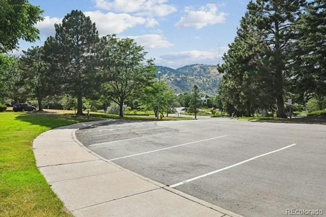 exterior space with a yard and a mountain view