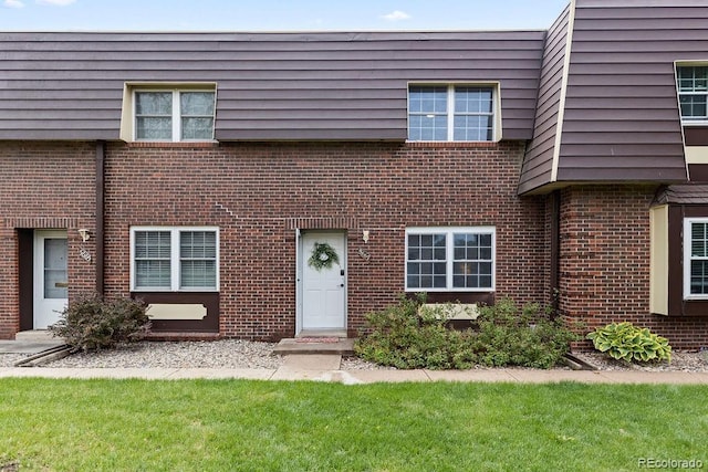 5667 S Lowell Blvd, Littleton, CO 80123 - multi unit property featuring brick siding and a front lawn