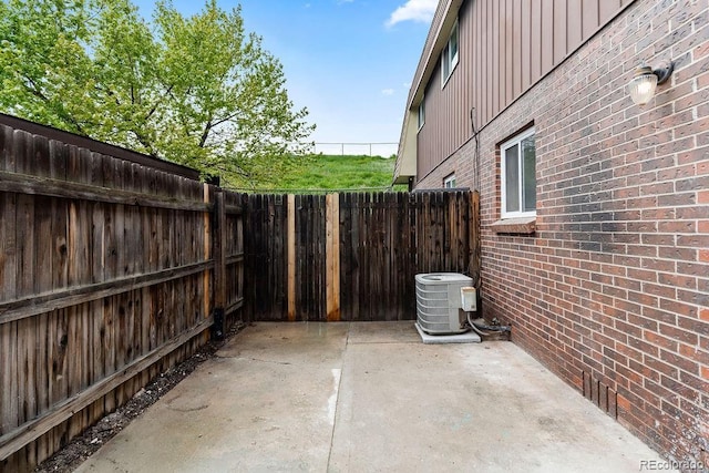 5667 S Lowell Blvd, Littleton, CO 80123 - view of patio with a fenced backyard and central AC