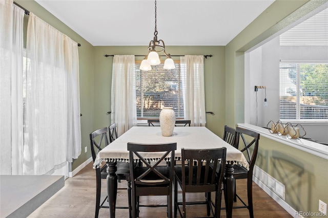 1464 Spotted Owl Way, Highlands Ranch, CO 80129 - dining room with a chandelier and wood finished floors