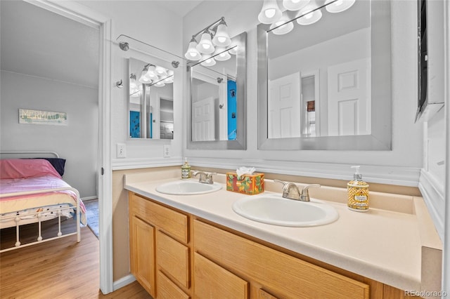 1464 Spotted Owl Way, Highlands Ranch, CO 80129 - ensuite bathroom with double vanity and wood finished floors