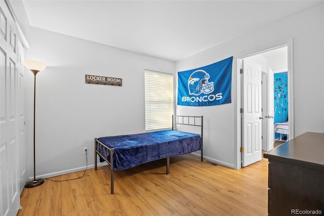 1464 Spotted Owl Way, Highlands Ranch, CO 80129 - bedroom with light wood-style flooring and baseboards
