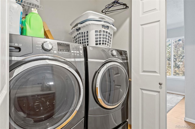 1464 Spotted Owl Way, Highlands Ranch, CO 80129 - laundry room featuring separate washer and dryer and wood finished floors