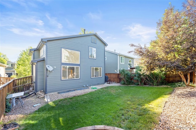 1464 Spotted Owl Way, Highlands Ranch, CO 80129 - rear view of house with a fenced backyard