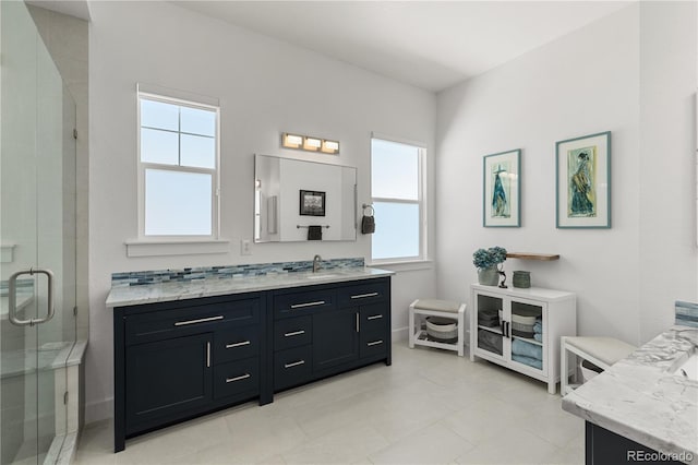 full bath featuring a stall shower and vanity