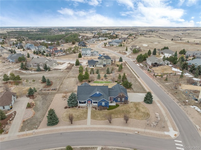 birds eye view of property with a residential view